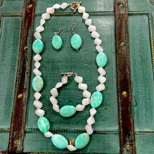 Necklace, bracelet, and earring matching set.